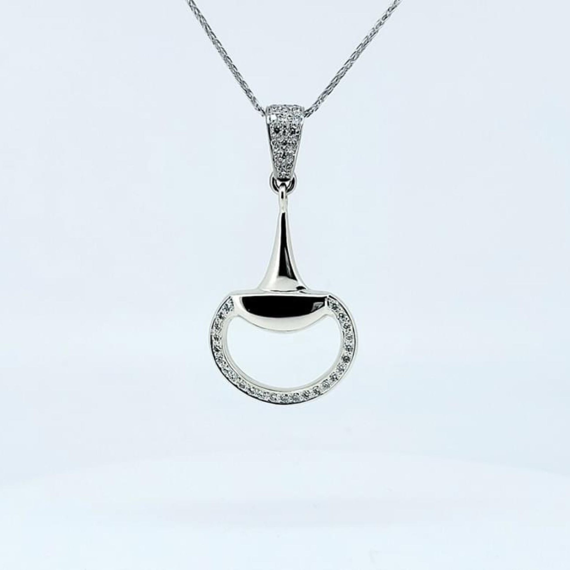 Product photo of Diamond set snaffle horse bit pendant in white gold by Crawford Hill Equestrian Jewellery.
