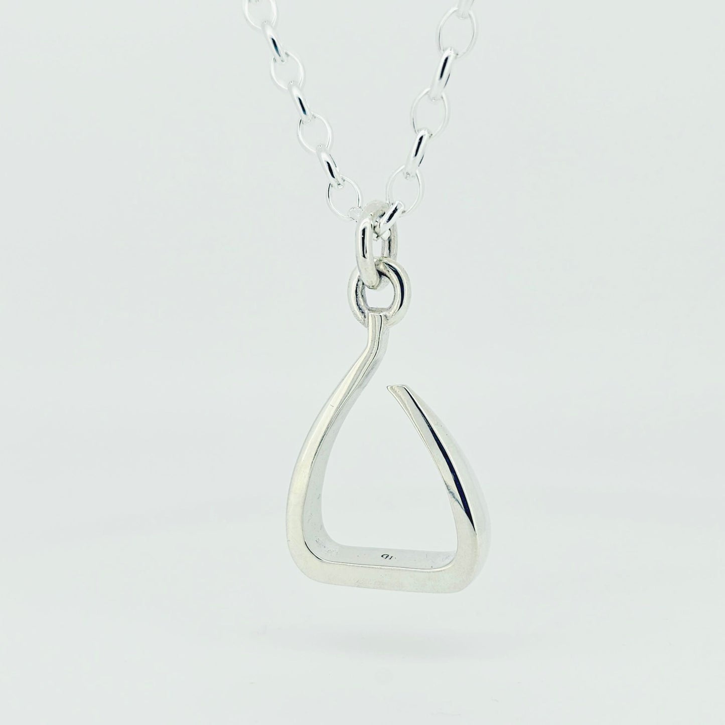 Silver jump stirrup necklace. Based on the Freejump Stirrup. Ring bale style. This is made for Horse riders and equestrians. Made by Crawford Hill Equestrian Jewellery.